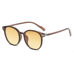 Stylish round oversized sunglasses with amber frames and yellow lenses for a vintage look