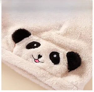 Close-up of children's plush panda fleece jacket with soft texture and cartoon pocket