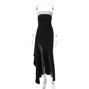 Detailed close-up of monochrome off-shoulder dress with side slit and pleated waist details