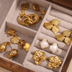 Vintage 18K gold plated earrings collection with starfish and pearls in a wooden box