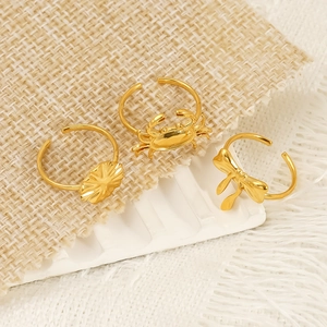 Three-piece gold 18k plated stainless steel open rings featuring crab, bow, and flower designs