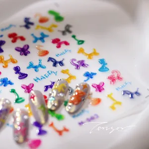 Macro shot of 3D colorful balloon dog and butterfly nail art stickers on clear base
