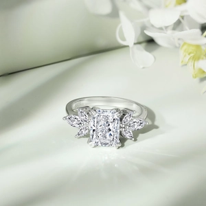 Macro shot of S925 silver ring featuring radiant cut square zircon and leaf accents