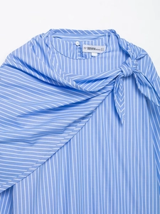 Detail shot of blue and white striped shirt neckline with size label S and shoulder texture