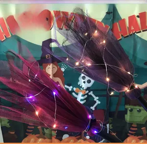 Detail of LED Halloween witch broom props with glowing mesh bristles and black handle