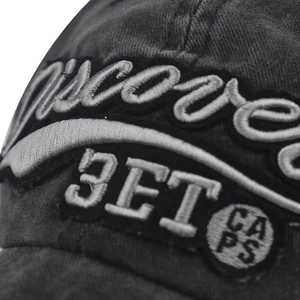 Close-up of embroidered 3ET and discover text on washed grey cotton baseball cap