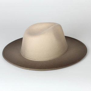 Close-up view of a gradient beige and brown felt fedora hat with a stylish flat brim