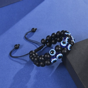 Men's double-layered evil eye bracelet with 10mm matte black beads and braided rope