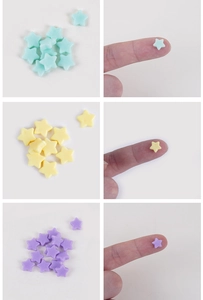 Détail macro de perles en résine colorées en forme d'étoile pour bijoux DIY et ongle