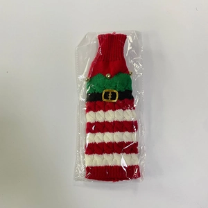 Knitted Christmas wine bottle cover with red stripes, green collar and gold bells