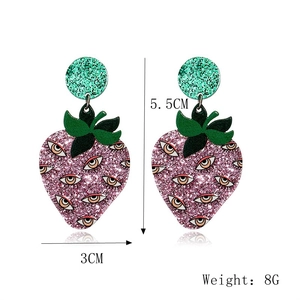 Detail view of purple strawberry earrings with eye patterns and dimensions 5.5cm by 3cm