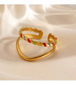 Detail of gold double-layer stainless steel ring with colorful oil drip on satin
