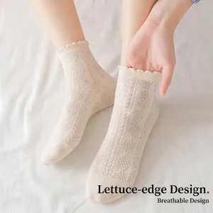 Breathable off-white cotton socks with hollow lace patterns and ruffled cuff design