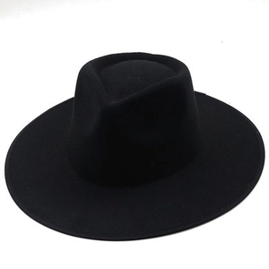 Detailed top view of a classic black wide-brimmed wool fedora with a pinched crown