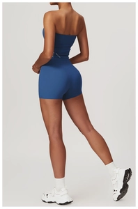 Back view of high-waist yoga shorts and blue tube top set showing supportive fit