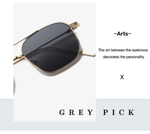 Macro shot of grey tinted lenses with sleek gold metal frames for stylish sunglasses