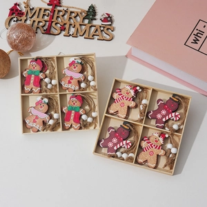 Detail of wooden gingerbread man ornaments set in storage boxes with festive decorations