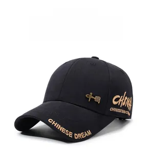 Detail view of black baseball cap with golden Chinese Dream embroidery and metal plate