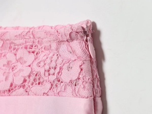 Detail of pink lace and satin stitching with matching invisible zipper on sexy skirt