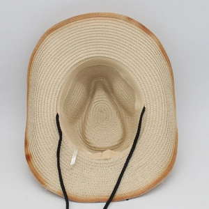 Detail of straw hat interior with sweatband, adjustable wind rope and gradient burnt edge