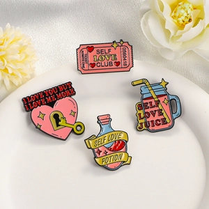 Set of 4 cute pink Self Love enamel pins including heart lock and potion designs