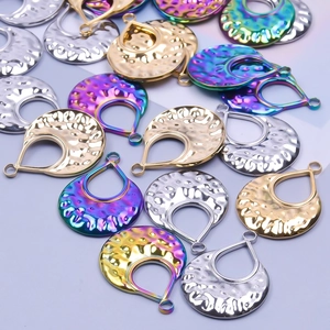 Detailed macro view of teardrop hammer textured DIY pendants in gold, silver and multicolor