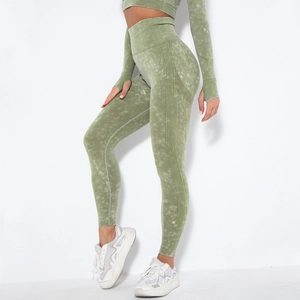 Detail of acid wash green seamless yoga leggings with ribbed texture and high waist