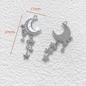 Detailed view of silver moon and star pendant with dimensions 17mm by 37mm
