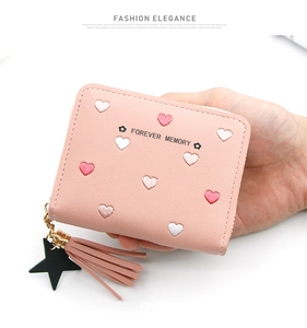 Pink short wallet with heart embroidery, fringe tassel, and star pendant detail