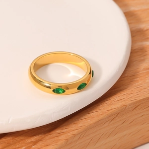 French retro gold plated ring with emerald green marquise cut zircons on stone stand