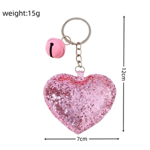 Pink glitter heart keychain with a bell, 12cm height, including product dimensions
