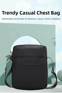 Detail of waterproof black oxford cloth shoulder bag with adjustable strap and zipper
