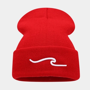 Close-up of red beanie featuring detailed wave embroidery on the high-elastic knit fabric
