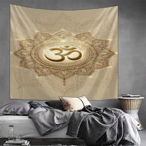 Detailed view of champagne gold Om symbol and intricate mandala pattern on wall tapestry