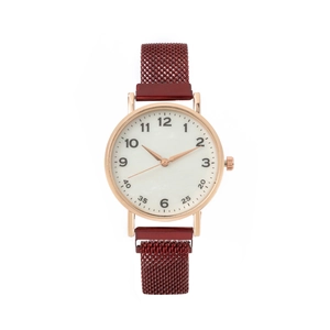 Close-up of rose gold watch with white dial and burgundy mesh magnetic strap