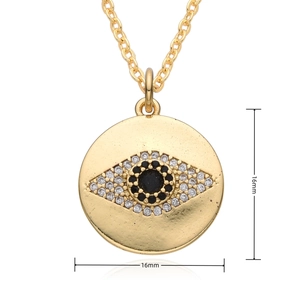Macro shot of 16mm gold evil eye pendant necklace with cubic zirconia details