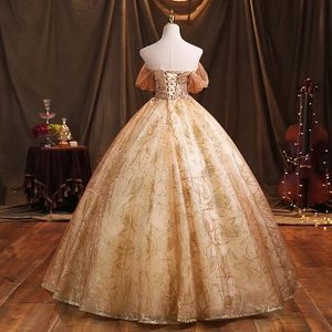 Elegant champagne gold evening gown with off-shoulder puffy sleeves and sequined patterns