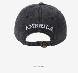 Detail of vintage washed grey cotton baseball cap with AMERICA embroidery and metal buckle