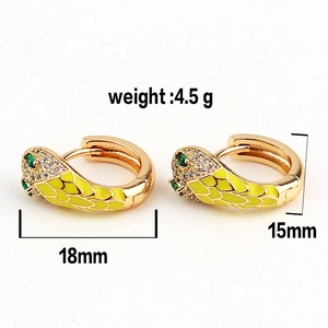 Detail of snake hoop earrings with yellow enamel, green eyes, and dimensions 18mm by 15mm