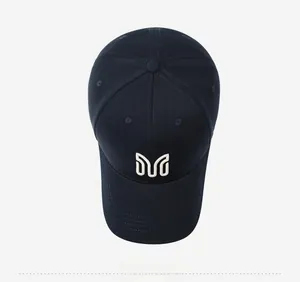 Top-down view of navy baseball cap featuring white embroidered geometric logo