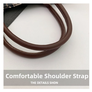 Detail shot of the ergonomic dark brown faux leather handle with premium stitching