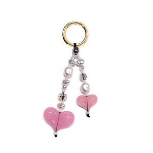 Colorful beaded keychain with pink hearts and white pearls on golden metal ring