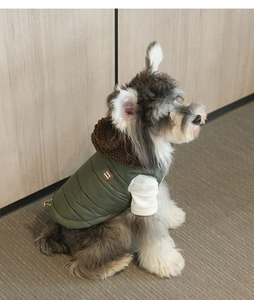 Detail of dog winter jacket featuring army green quilted vest and plush fleece collar