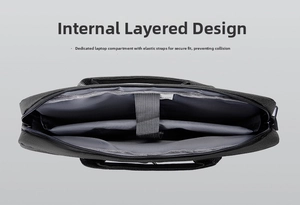 Detail view of laptop bag internal shockproof compartment with elastic security strap