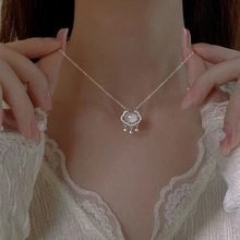 Detailed close-up of Ruyi lock pendant on S925 silver chain with pearl stone inlay