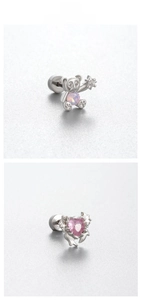 Dettaglio di orecchini a forma di orso con opale e zircone rosa a forma di cuore