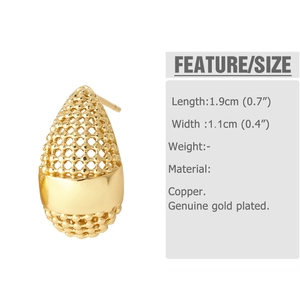 Detailed view of teardrop earrings in gold-plated copper with hollow mesh pattern
