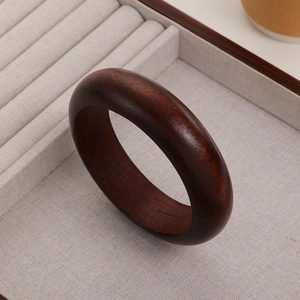 Minimalist sandalwood bracelet with natural dark wood grain in traditional Chinese style