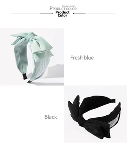 Detail of wide bow headband with lace trim in fresh blue and black textured fabric