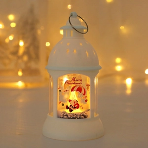 Macro detail of a white LED Christmas lantern featuring Santa Claus and star cutouts
